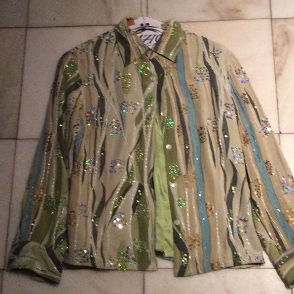 Size small vintage green and blue sequin button- down bought inParis